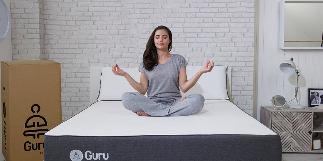 Woman meditating on the guru by zen mattress